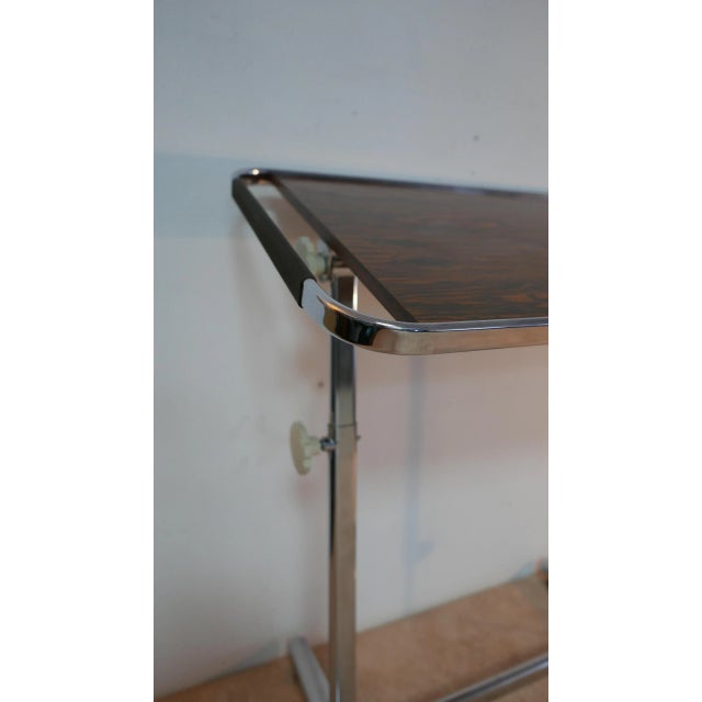 Continuously adjustable in height from 60 cm to 80. Luxury Palisander Dekor / chrome finish. A side strut folded,...