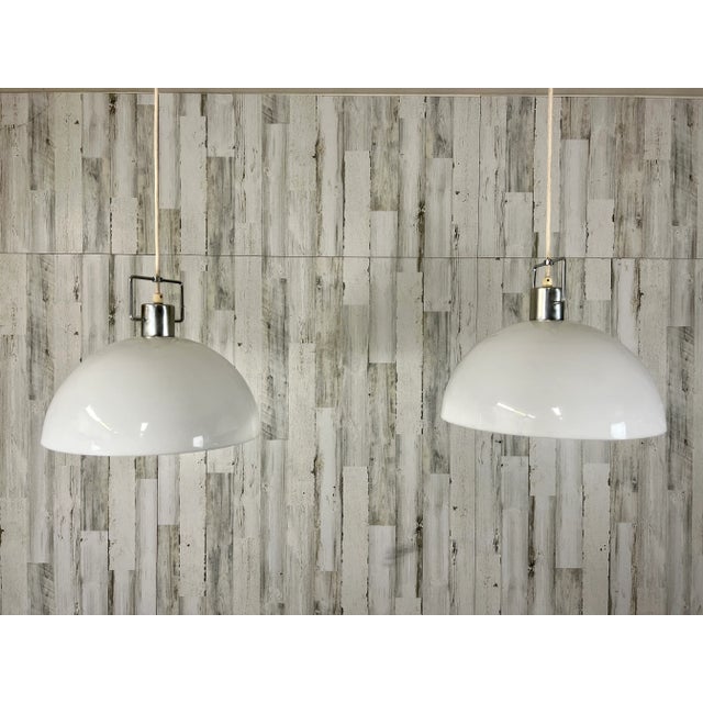 Nice Plastic dome pendant with nickel plated cap and glass globe.