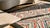 Textile Attractive Multicolor Background and Black Border With Folk Art Style Antique American Hooked Rug For Sale - Image 7 of 9