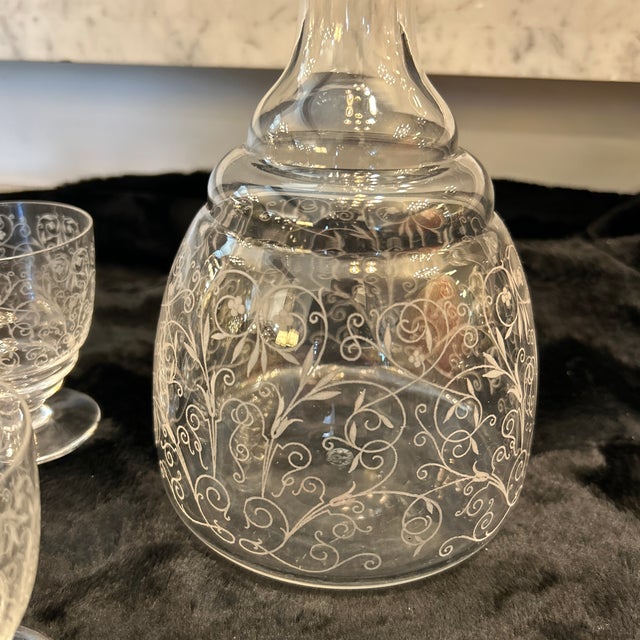 This is a Crystal Baccarat "Lulli" pattern liqueur decanter with 5 matching cups/glasses set. The set features an etched...