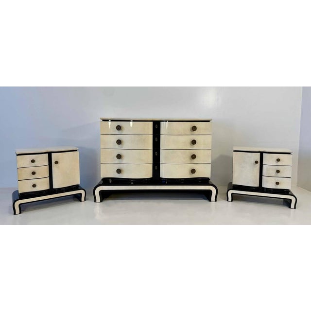 Elegant Italian Art Deco bedroom set from the 1940s, consisting of a chest of drawers and a pair of bedside tables,...