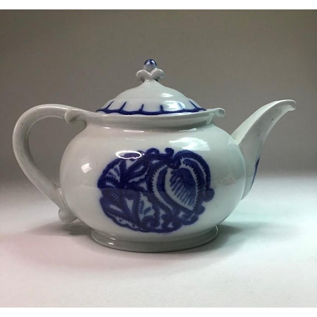This beautiful ceramic object is a teapot "Lilyblå", also called "Arbetarservisen", of Gustavsberg. The teapot is signed...