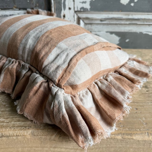 Made in France A timeless linen accent pillow with ruffle and tattered edges woven in France — The latest collection is a...