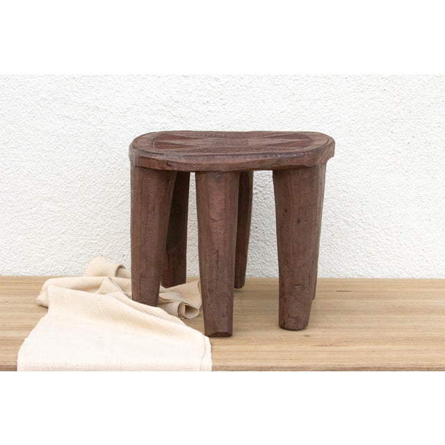 A unique piece of African art, this vintage Nupe table from Nigeria is a must-have for collectors and enthusiasts of Nupe...