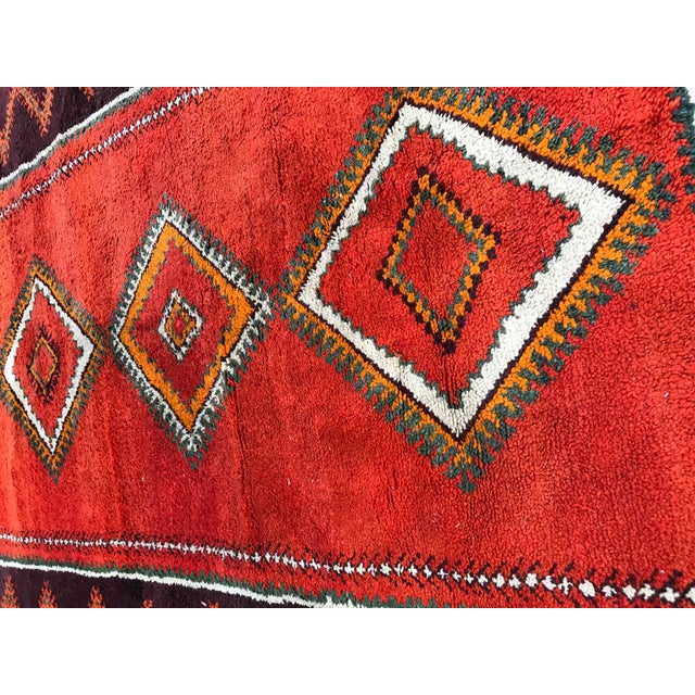 Very beautiful and original vintage Moroccan runner with nice red field color and geometrical tribal design, first half of...