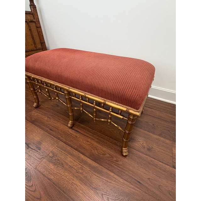 Gilt Finished Faux Bamboo Chinese Chippendale Upholstered Styled Bench in as found vintage condition. No breaks in the...