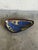 This vintage ceramic dish stands out with an organic elongated triangle form and a shallow basin. The interior features a...