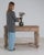 This writing desk carries genuine presence, its whitewashed weathered wood, single drawer, turned legs immediately setting...