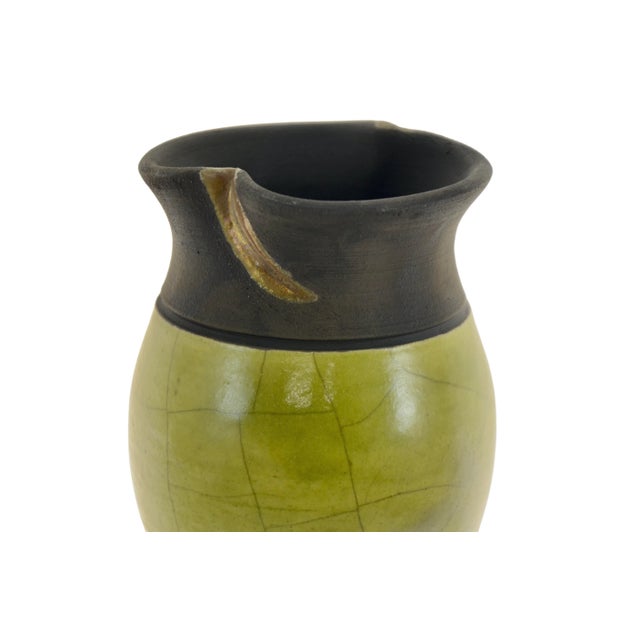 Hand thrown vintage studio art vase in chartreuse crackle glaze over chocolate clay with a pinched neck. Signed underside....