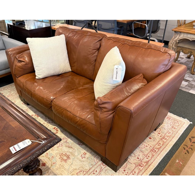 Design Plus Gallery presents an Italian Leather Sofa. This comfortable sofa has a lot going for it, even with the years it...