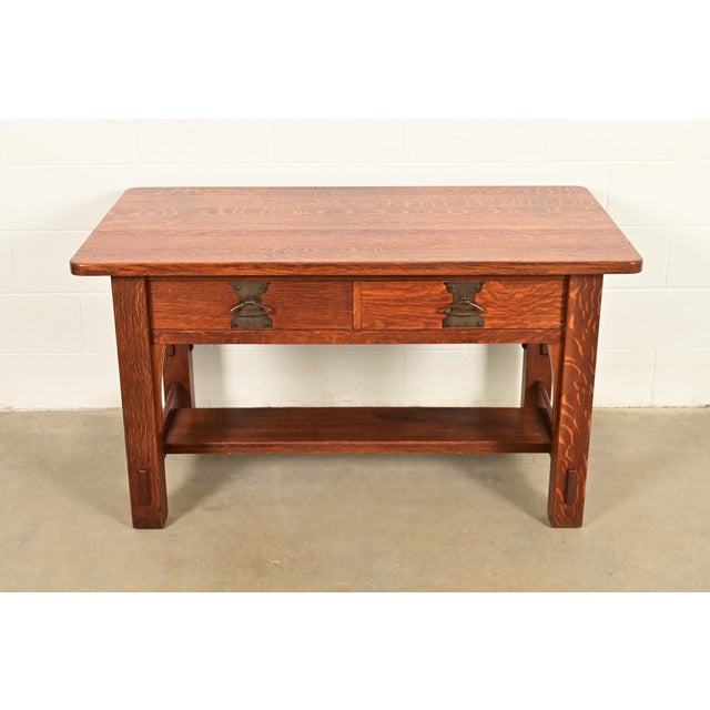 An exceptional antique Mission or Arts & Crafts writing desk or library table In the manner of Stickley Brothers By...
