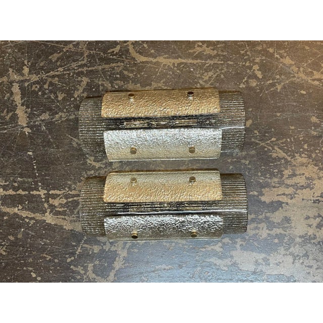 Pair of modern Murano glass two tone layered sconces. Circa 2000. The sconces have been professionally rewired and ready...