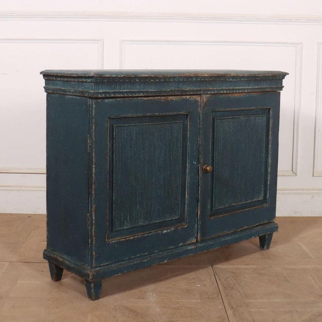 Small 19th Century Swedish two door buffet with reeded details to the doors. 1890 This piece is designed in the style of...