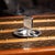 Antique 20th Century American solid silver ashtray and matchbox holder by Tiffany & Co. The circular ashtray features...