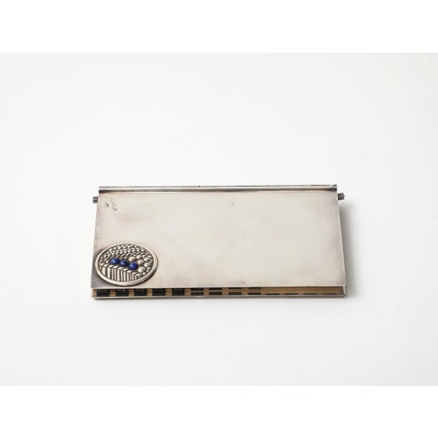 Art Deco style sterling silver address book by Carlo Buffetti, circa 1970. Raised sterling detail with three lapis lazuli...