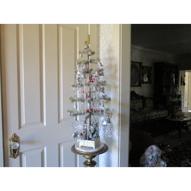 This vintage replica first artificial Christmas tree with ornaments is a rare find for collectors and enthusiasts of...