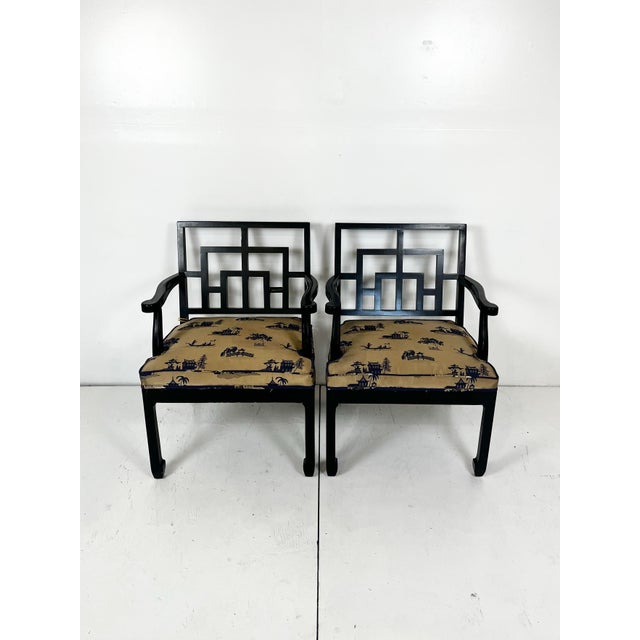 Vintage pair of chinoiserie Ming style arm chairs. Fretwork square backs with ming style legs. Classic Hollywood Regency...