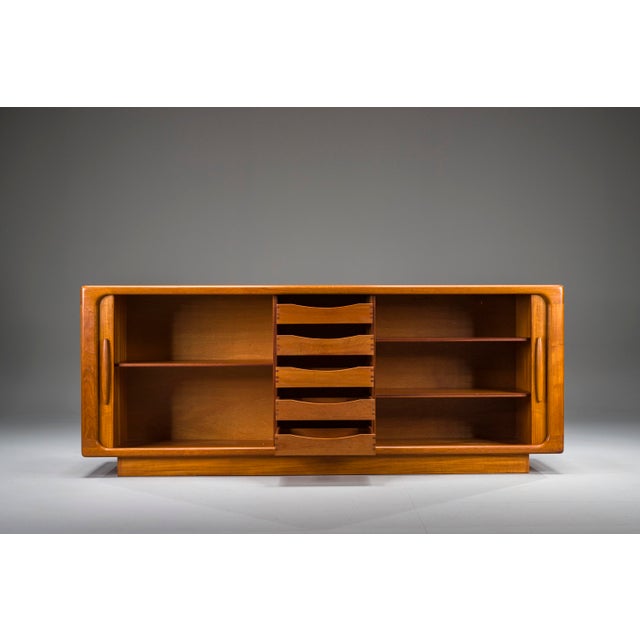 Exceptional 1960s teak sideboard by renowned Danish manufacturer Dyrlund. This piece exemplifies the clean lines and...