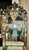 The product is an early 20th century Venetian etched mirror, perfect for adding a touch of elegance to any room. This...