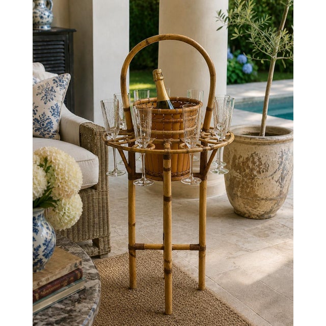 A wonderfully unusual mid-century champagne butler stand crafted from bamboo and woven rattan. The tall looped handle...