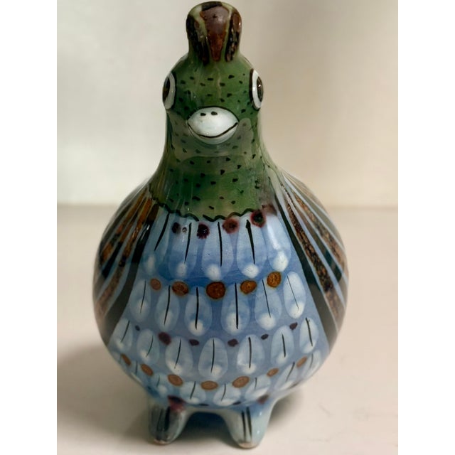 The charming appeal of Mexican folk art is evident in this blue and green quail. This example of Mexican Tonala Pottery...