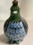 The charming appeal of Mexican folk art is evident in this blue and green quail. This example of Mexican Tonala Pottery...