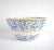 An antique, 19th-century, c. 1880-1890 mixing bowl in heavy stoneware mold-pressed pottery with a cream base and blue...