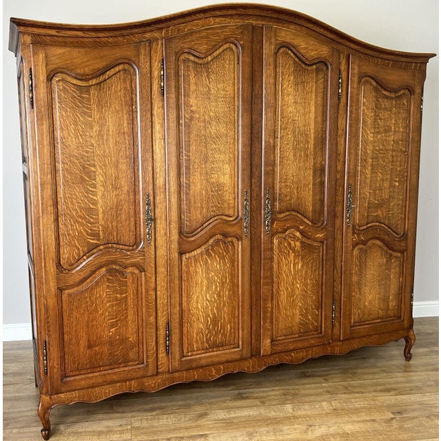 This elegant Vintage French Louis wardrobe combines generous storage space with timeless French styling. Featuring a...