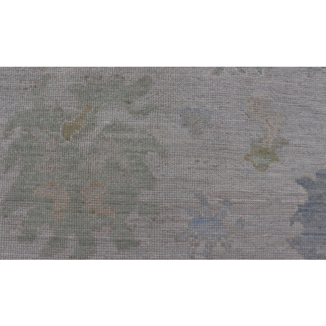 Modern Tribal Oushak With a Cream Border and Light Gray-Blue Background For Sale - Image 4 of 13