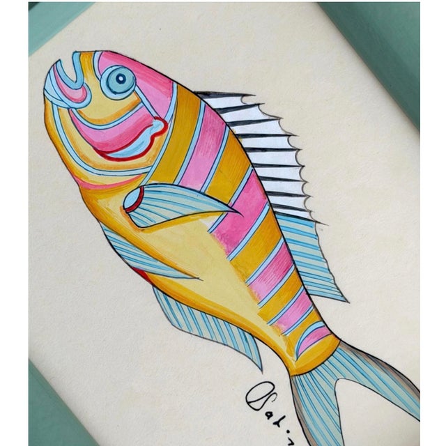 A happy hand-painted fish full of cheerful color and beautiful detailing. Hand-painted by master artists using acrylic...
