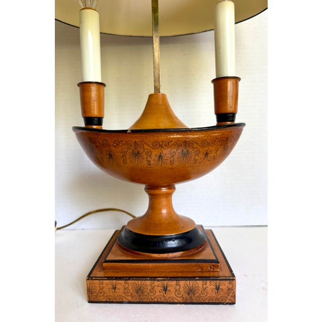 Here is a fabulous mid-century Italian Neoclassical tole bouillotte lamp, finished in a wonderfully rich terracotta with...