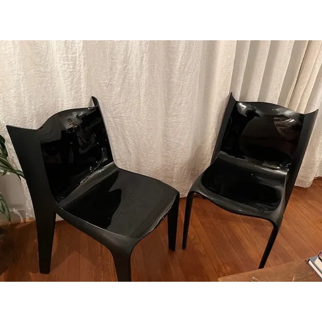 Stackable chair produced by Alias design Marco Acerbis, Fly model, year 2006. Structure in black injection-moulded nylon...