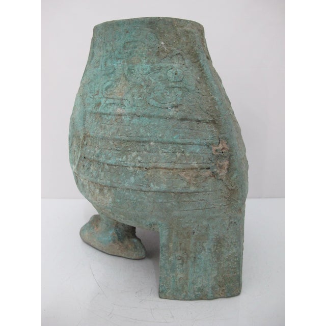 Chinese ritual bronze wine vessel shaped like an owl or bird, styled after the archaic zoomorphic vessels of the Shang...