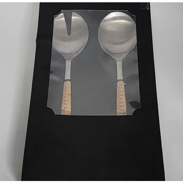Elevate your dinner parties with the Rattan Stainless Steel Serving Pieces (Set of 2). This stunning set includes a...