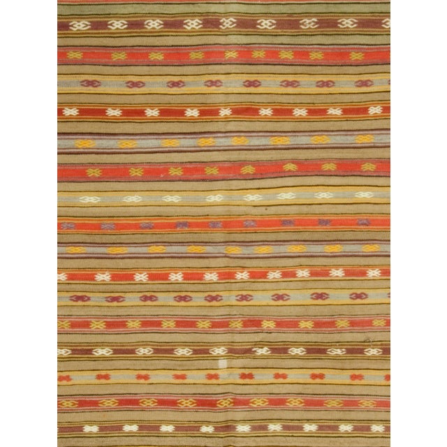 This vintage Turkish flat-weave Kilim, handwoven in the 1940s, embodies both simplicity and boldness. Its versatile design...