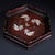 This is a striking, hexagonal wooden tray featuring intricate mother-of-pearl (nacre) inlay. Crafted from a dark, richly...