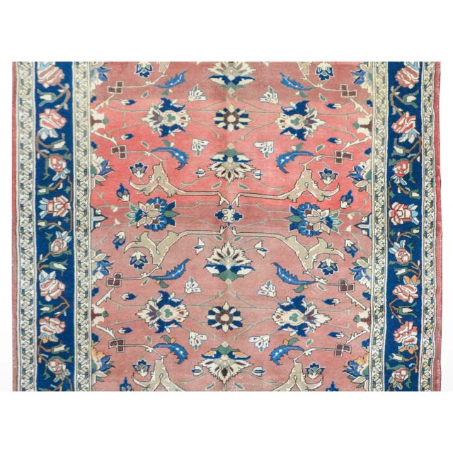 An outstanding early 20th century Persian Lilihan rug with a finely rendered floral pattern woven in light and dark...