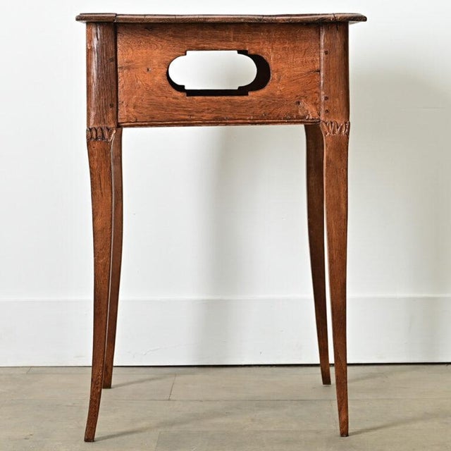 Dimensions: 28 ⅛” H x 25 ¾” W x 18 ½” D A sweet Louis XV style 19th century oak bedside table, or "table de chevet" the...