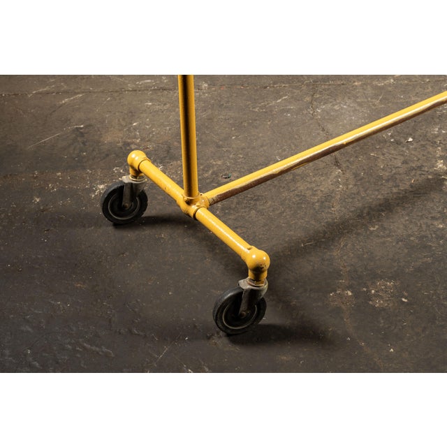 Vintage Industrial Pipe Rolling Garment Rack in Yellow For Sale - Image 4 of 6
