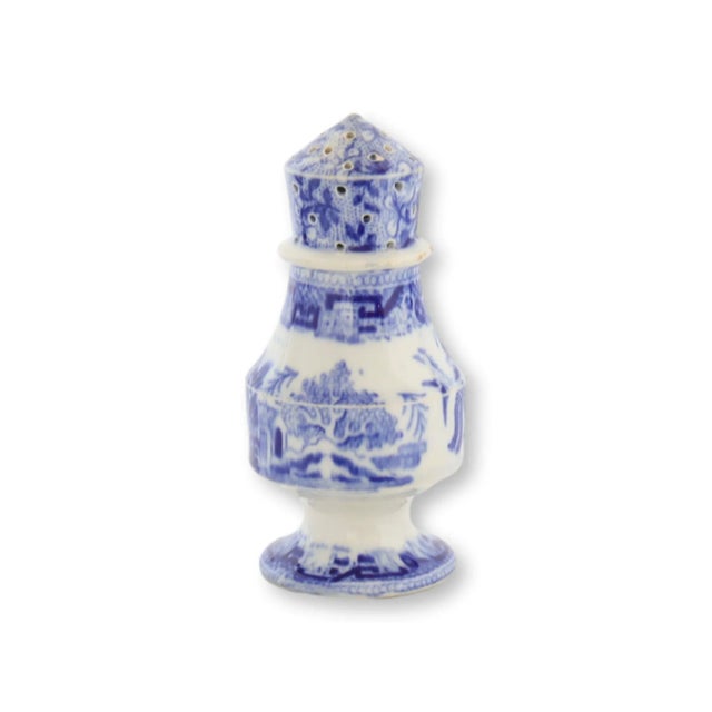 Evoking the elegance of the Downton Abbey dining room, this 1850s pearlware pepper pot in classic blue and white Willow...