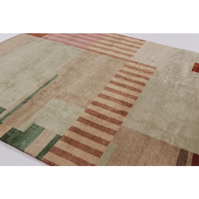 Hand-knotted in wool, this 10x10 rug by Rug & Kilim is a new addition to the French Art Deco rug collection—a contemporary...
