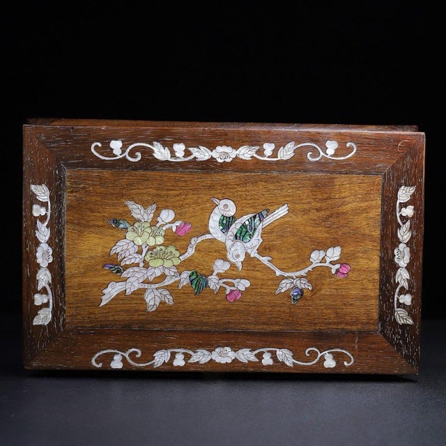 A beautifully crafted Chinese low table or display stand, likely made of Huali (rosewood). The piece features a...