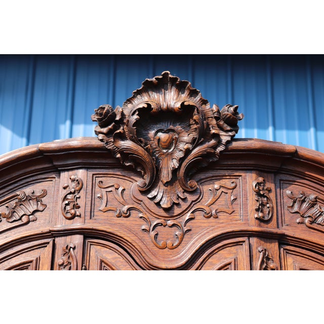 An exceptionally rare and imposing pair of French carved oak display cabinets, executed in the grand Louis XIV taste and...