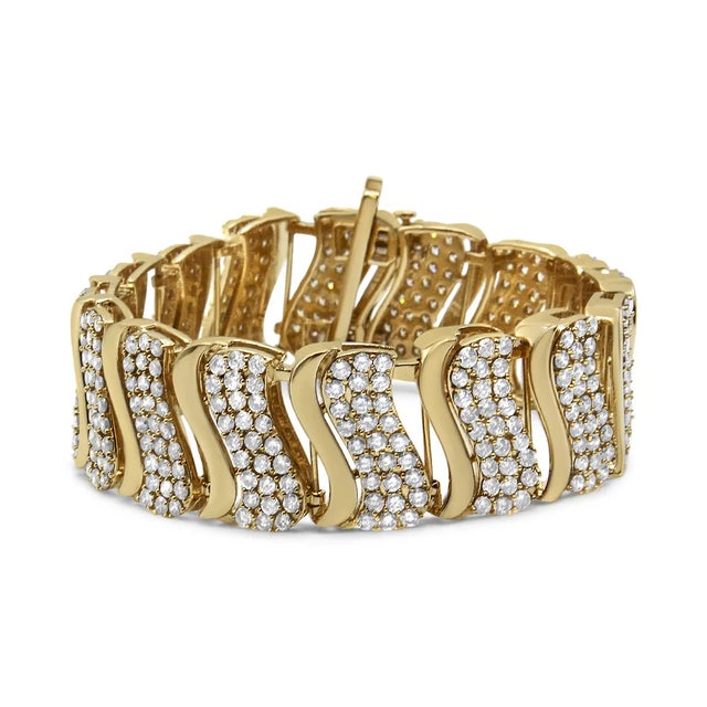 Make your grand entrance with this luxurious diamond link bracelet. Crafted from weaves of warm 14K Yellow Gold, this...