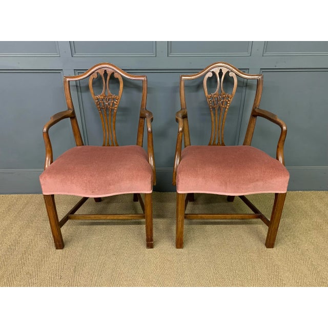 A charming pair of George III , Hepplewhite period, Armchairs. Well constructed in solid mahogany, now with a good mellow...
