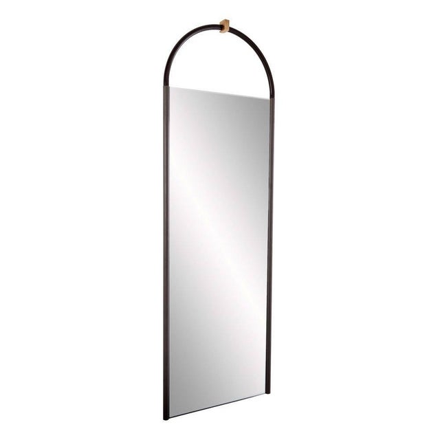 The Shelvin floor mirror unites graceful lines with handsome finishes. The mirror is designed with an arched dim gray...