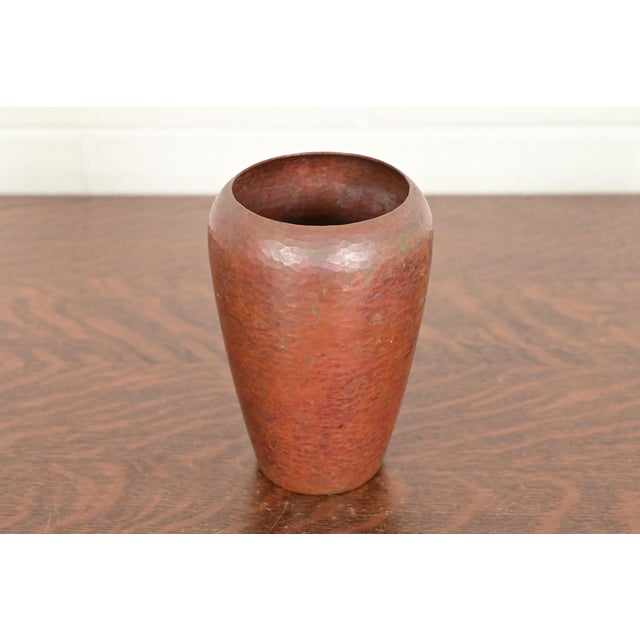 A gorgeous Arts & Crafts hand hammered copper vase In the manner of Roycroft By Ramon Ramirez Mexico, Mid-20th Century...