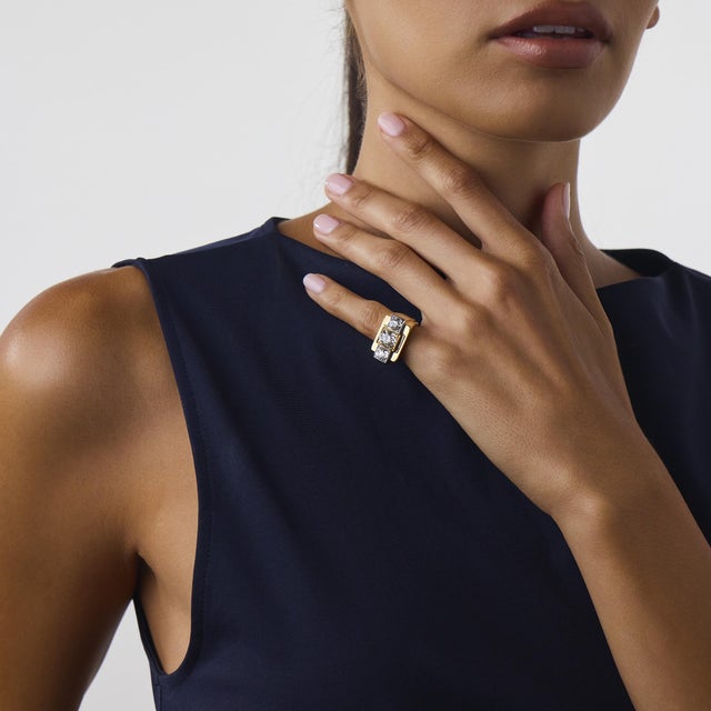 This exceptional Retro French diamond tank ring is a striking 1940’s design, centered by a GIA-certified old mine cut...