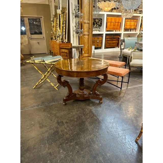 Handsome 19th century Italian carved walnut center table. Featuring a beautiful, polished finish and a lovely carved...