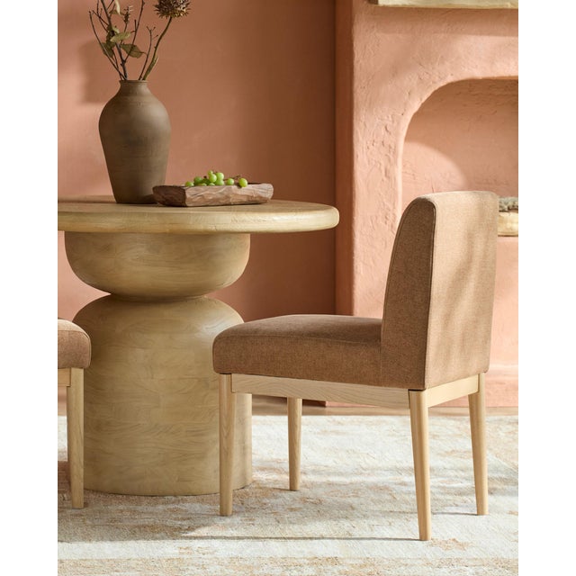 Meet the Mollie Dining Chair, a stunning blend of elegance and comfort that elevates any dining experience. This exquisite...
